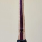 Black Compact Bass with Flame Maple and Purple Heart Neck.